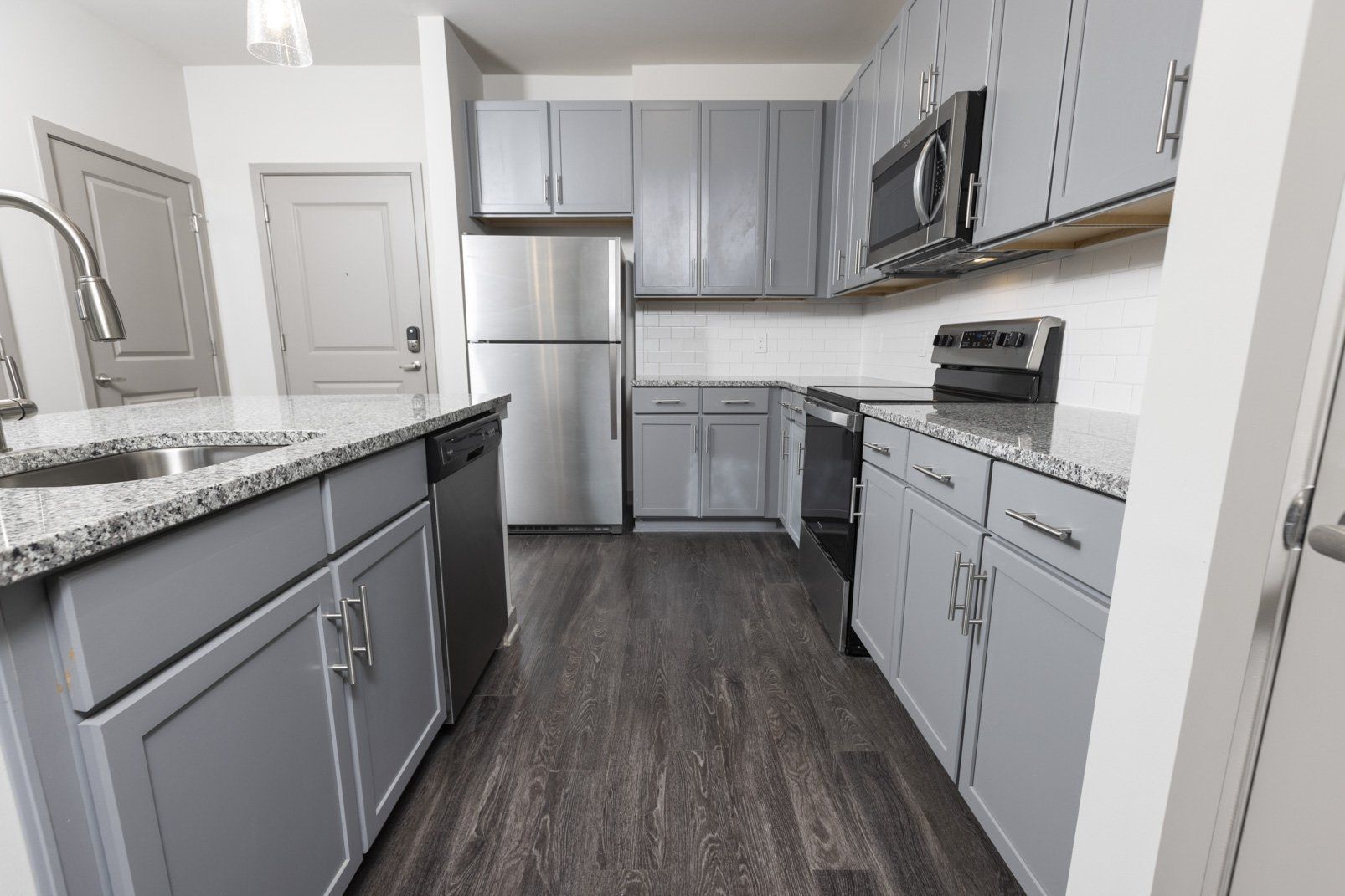 kitchen with grey cabinets at Parc at Murfreesboro