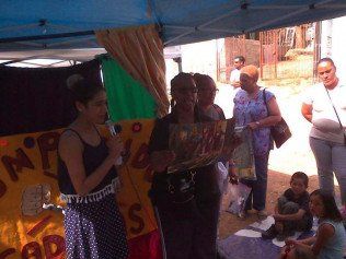 A woman stands in front of a sign that says np