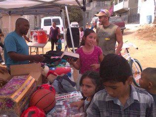 A group of people standing around a table with a basketball on it