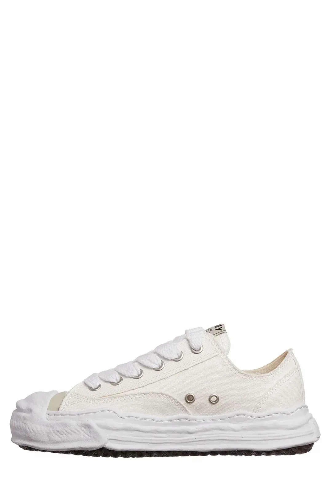 White distressed low-top sneaker with frayed edges and a thick, textured sole.