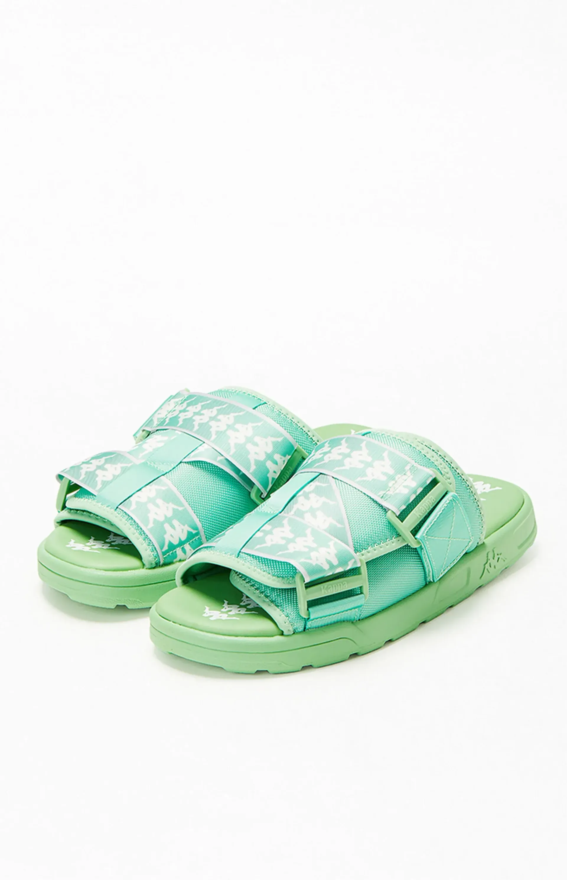 Green sandals with white snowflake pattern.