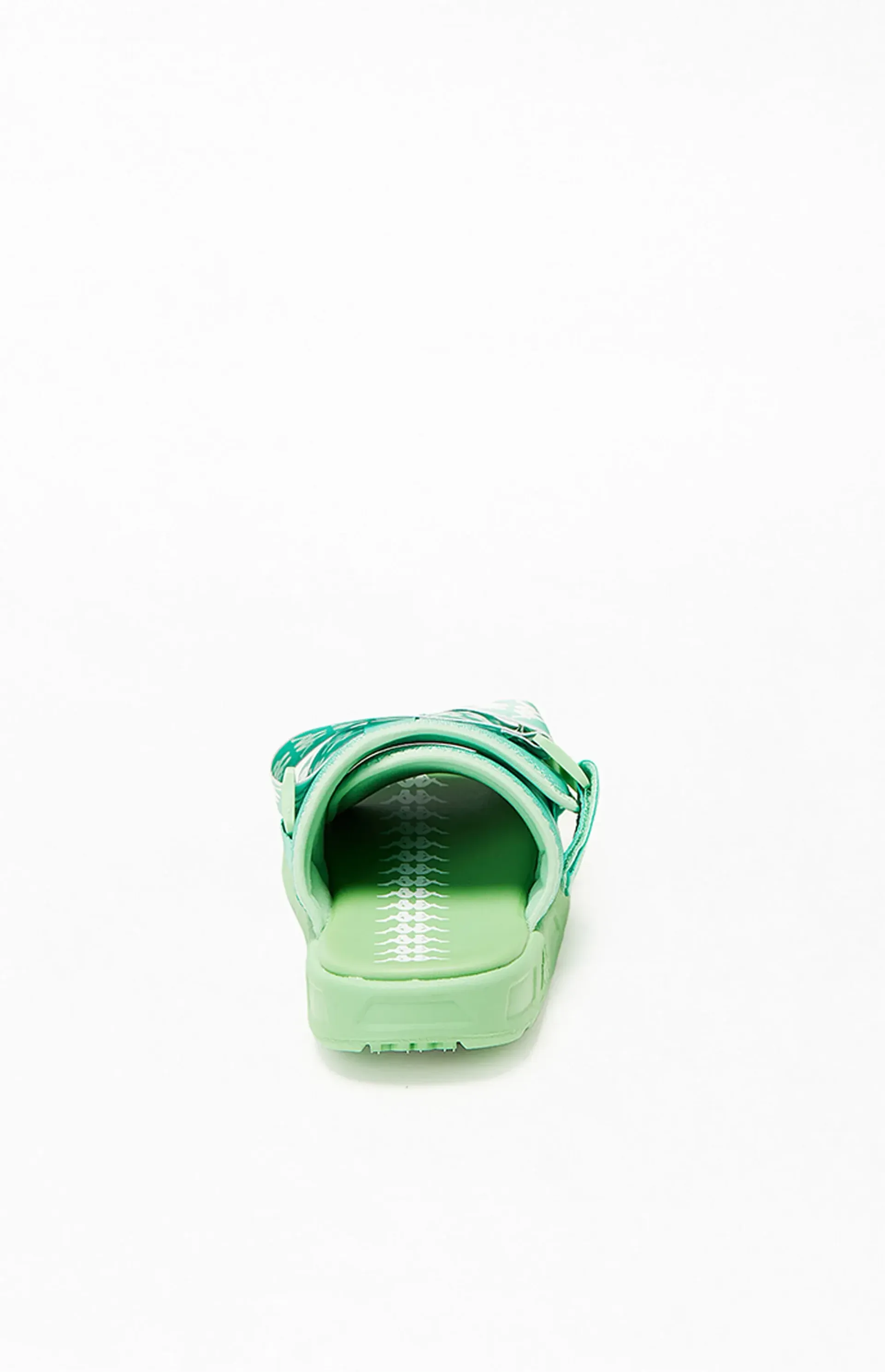 Green sandal, rear view, on a white surface.