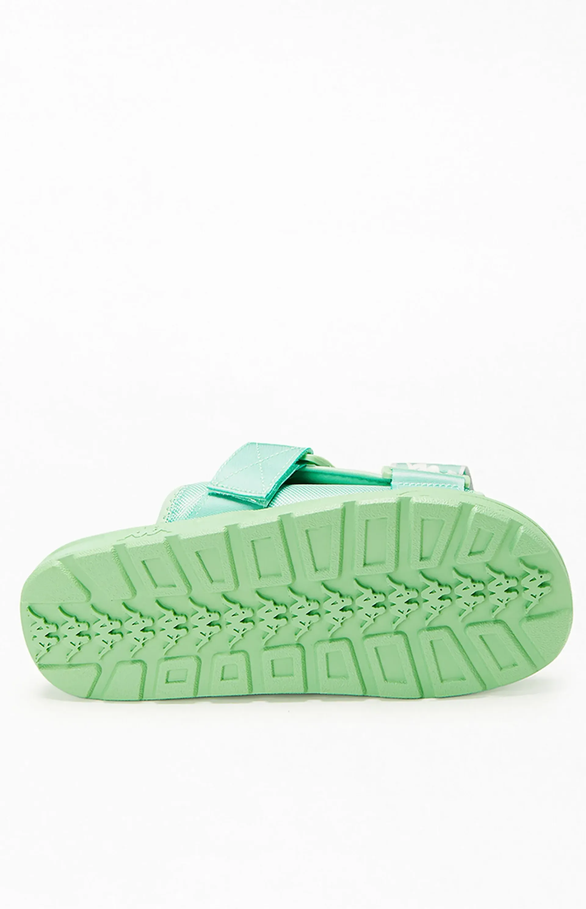 Green sandal sole with textured tread.