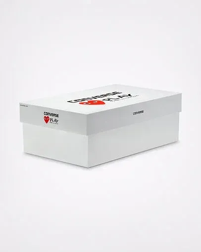 White rectangular shoe box with red heart and text on top.