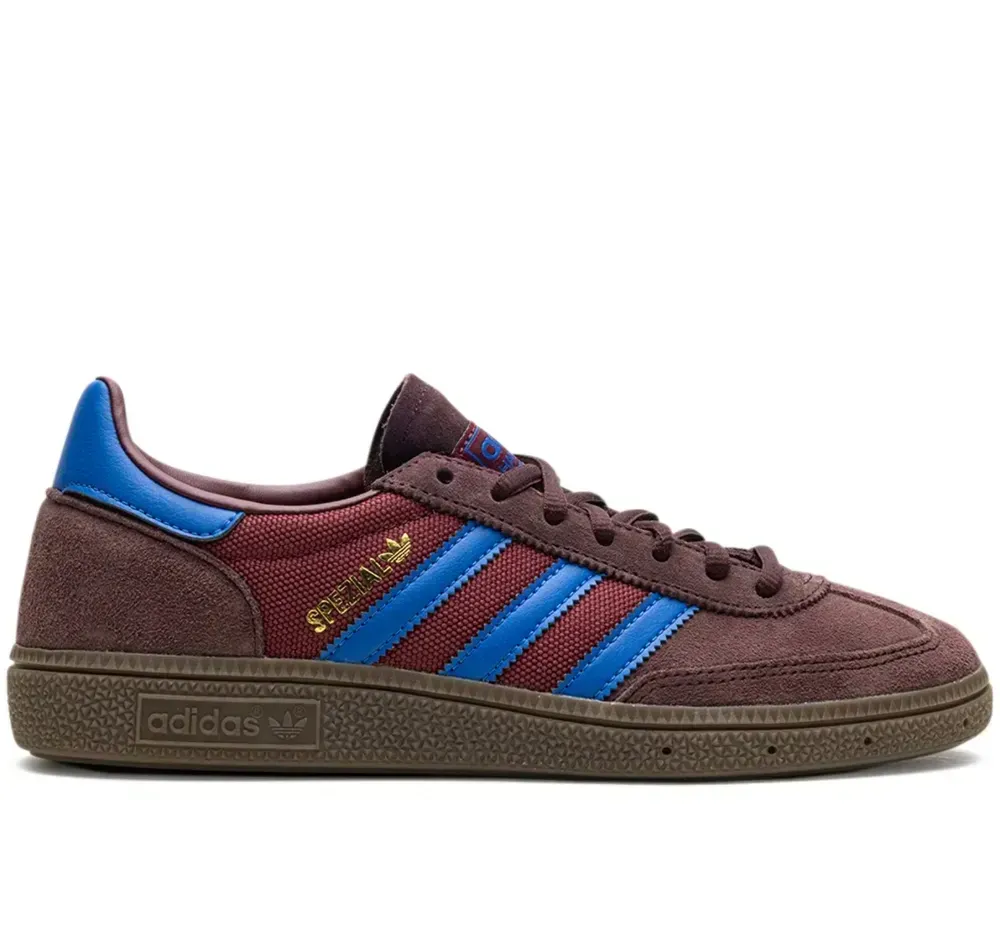 Brown Adidas Handball Spezial sneakers with blue stripes and accents.