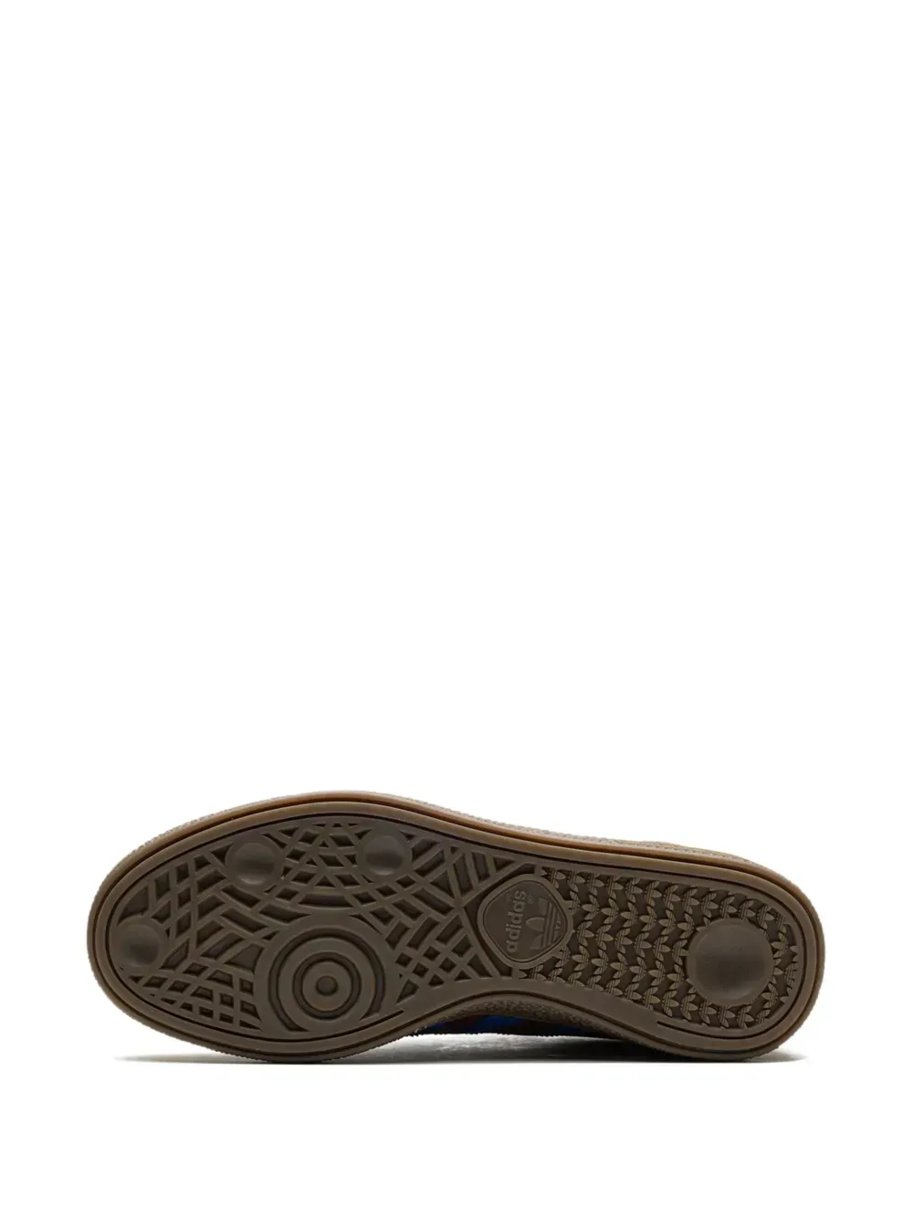 Brown sneaker sole with textured grip pattern.