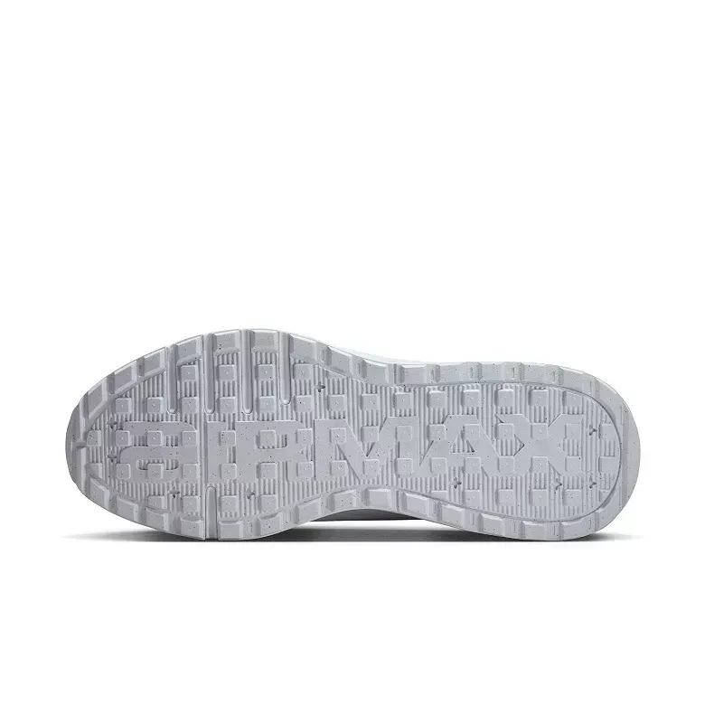 Sole of a light gray athletic shoe with a textured pattern.