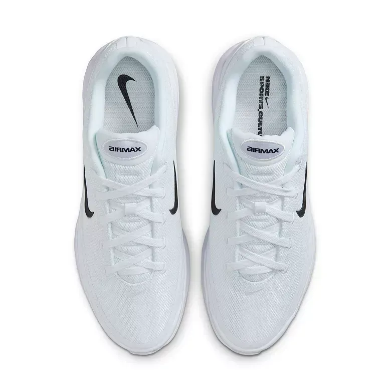 Two white Nike running shoes from a top-down view, with black swooshes on sides.