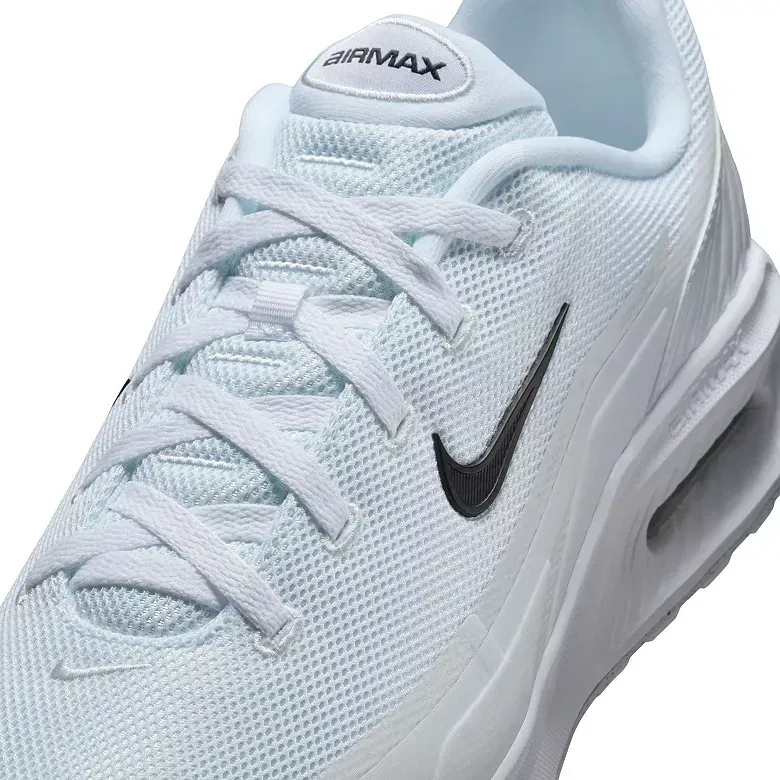 Light blue Nike Air Max sneaker with black swoosh and white laces.