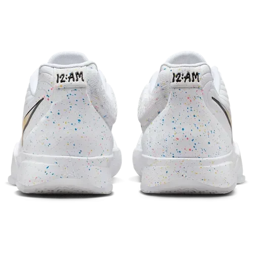 Pair of white Nike shoes with speckled pattern and 