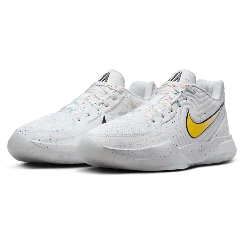 White Nike basketball shoes with yellow swoosh, speckled details.