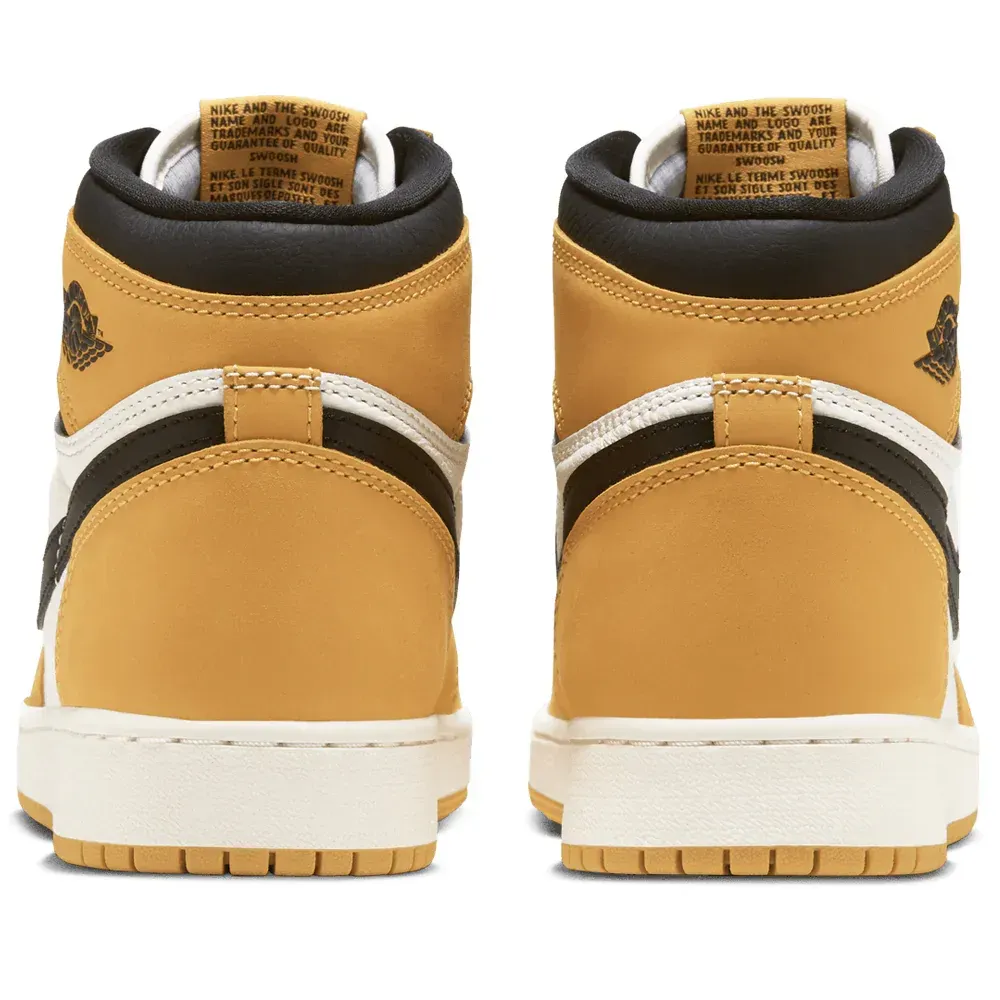 Two pairs of mustard yellow, black, and white Air Jordan 1 high-top sneakers.