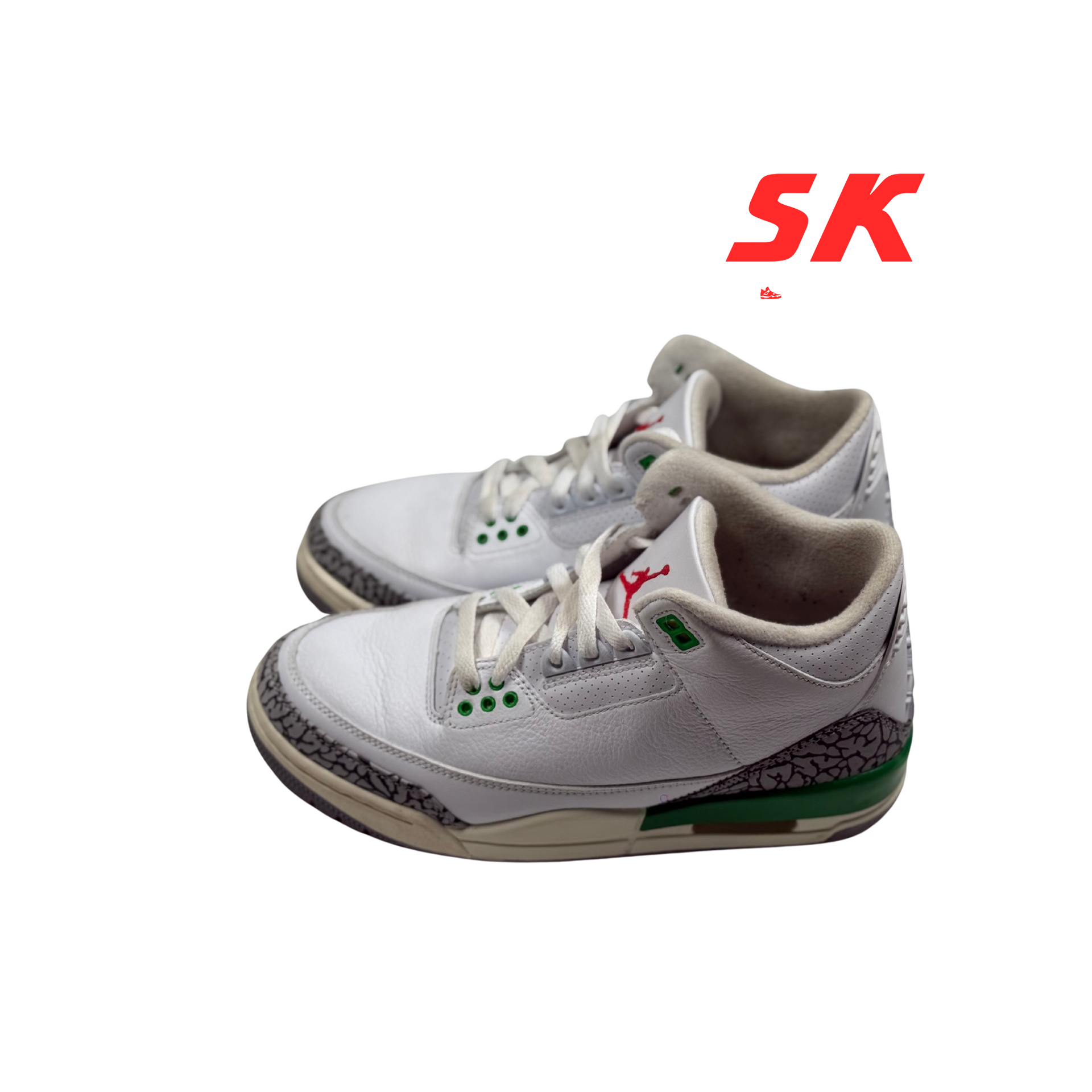 White and green toddler Air Jordan sneakers with elephant print accents.