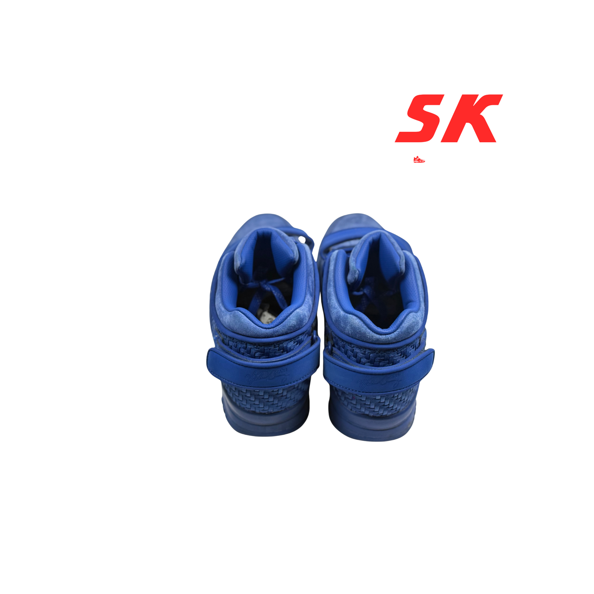 Blue sneakers with velcro straps.