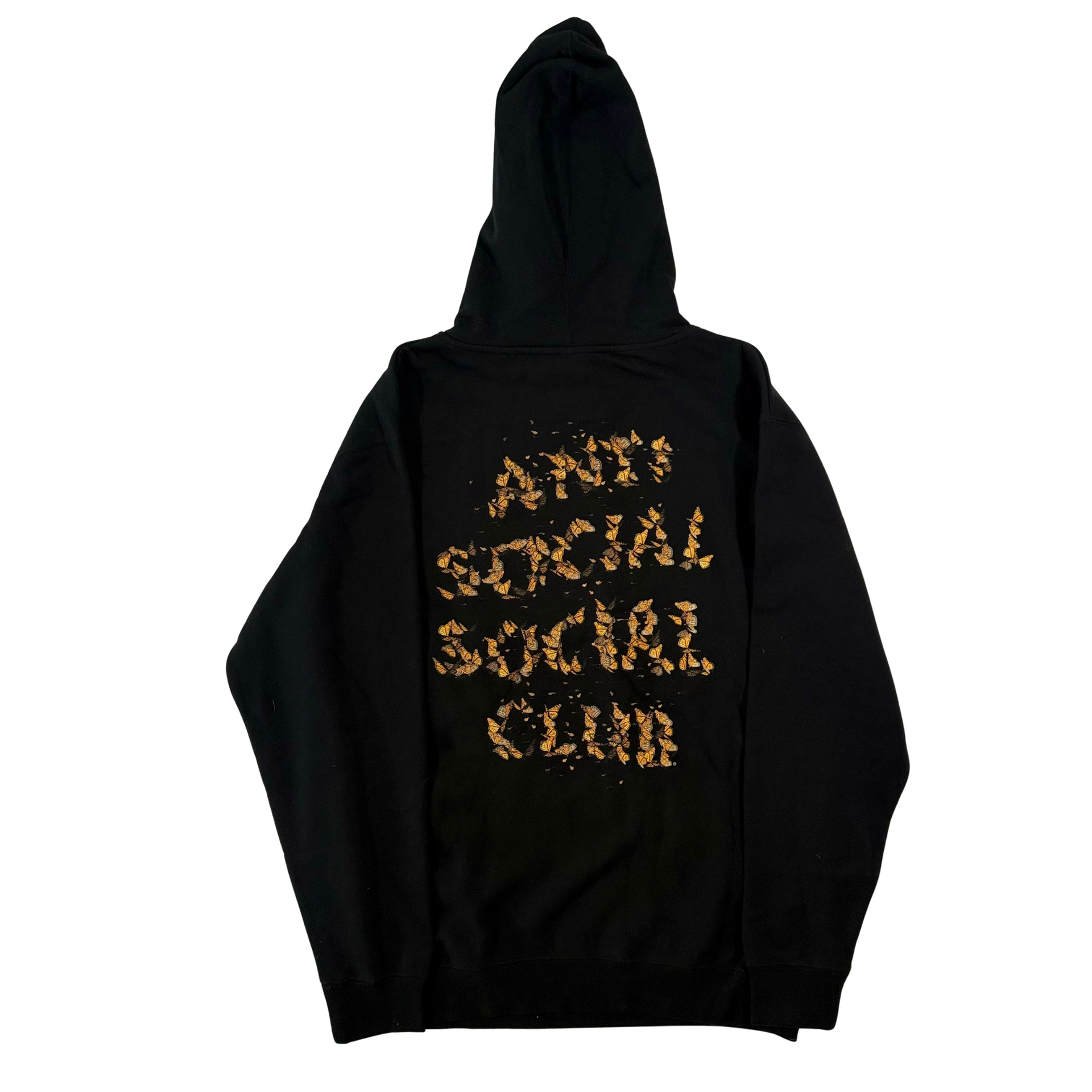 Black hoodie with gold text, front pocket, hood up.