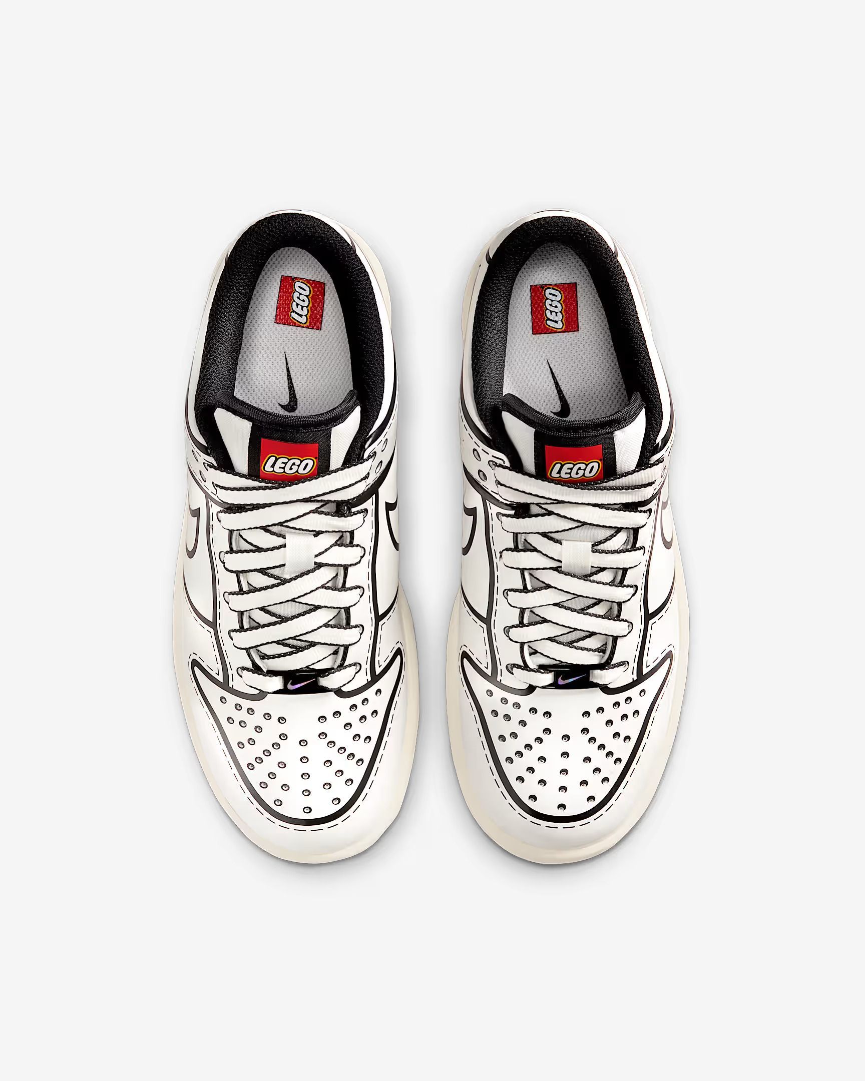White Nike Dunk sneakers with black outline and red accents.
