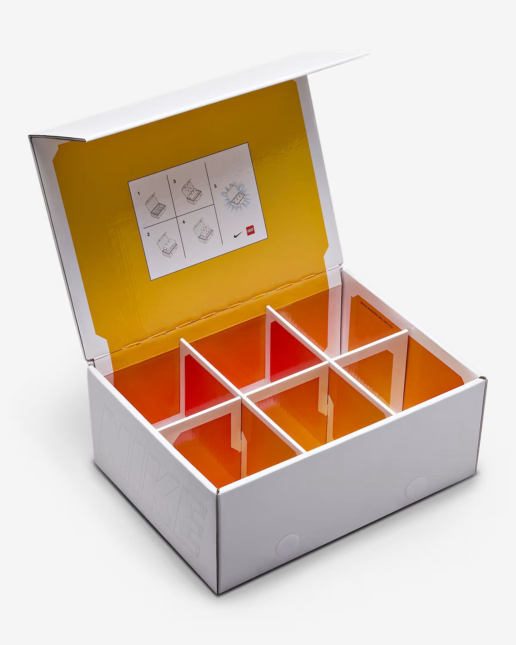 White box with yellow interior, divided into eight compartments.