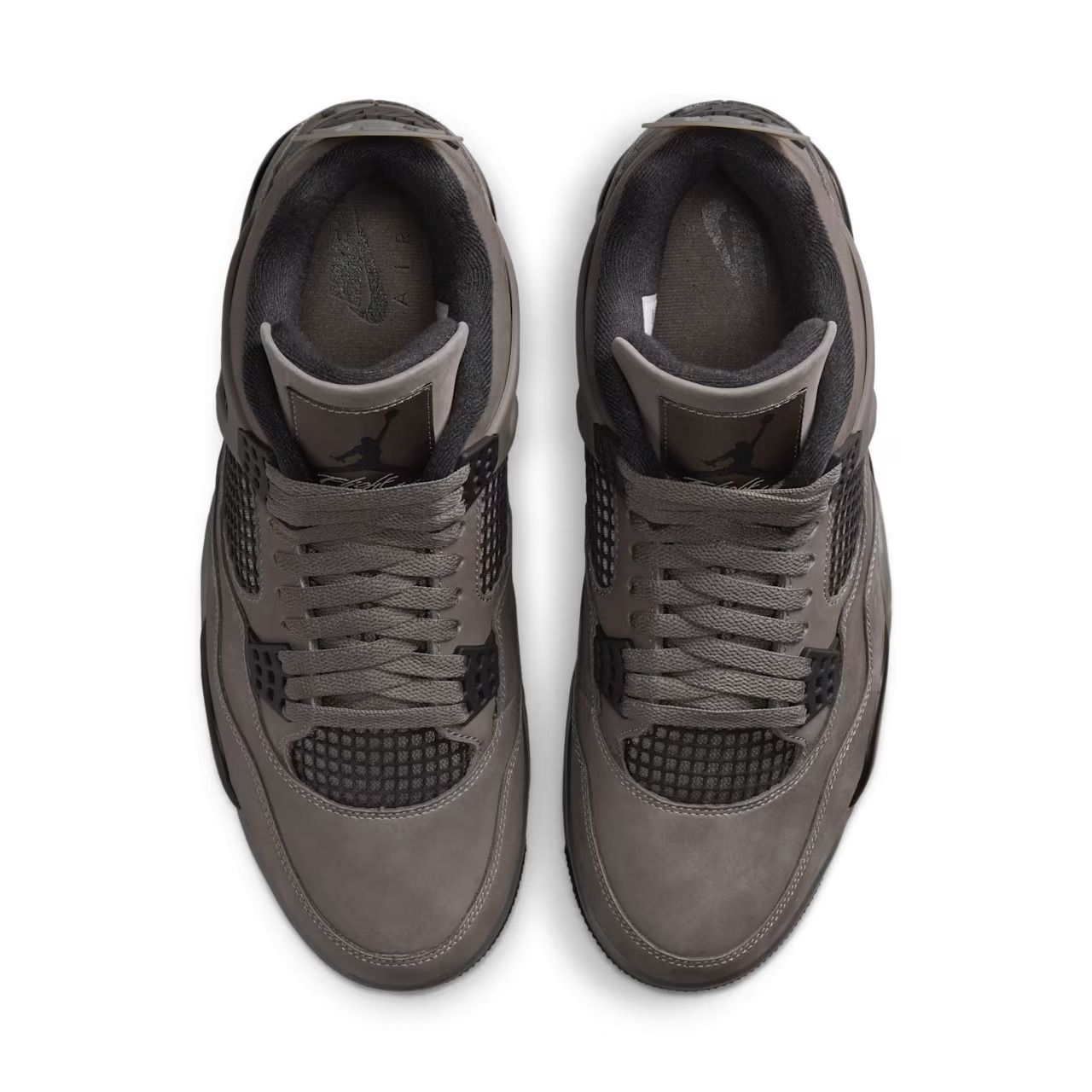 Pair of grey and black Air Jordan 4 sneakers.