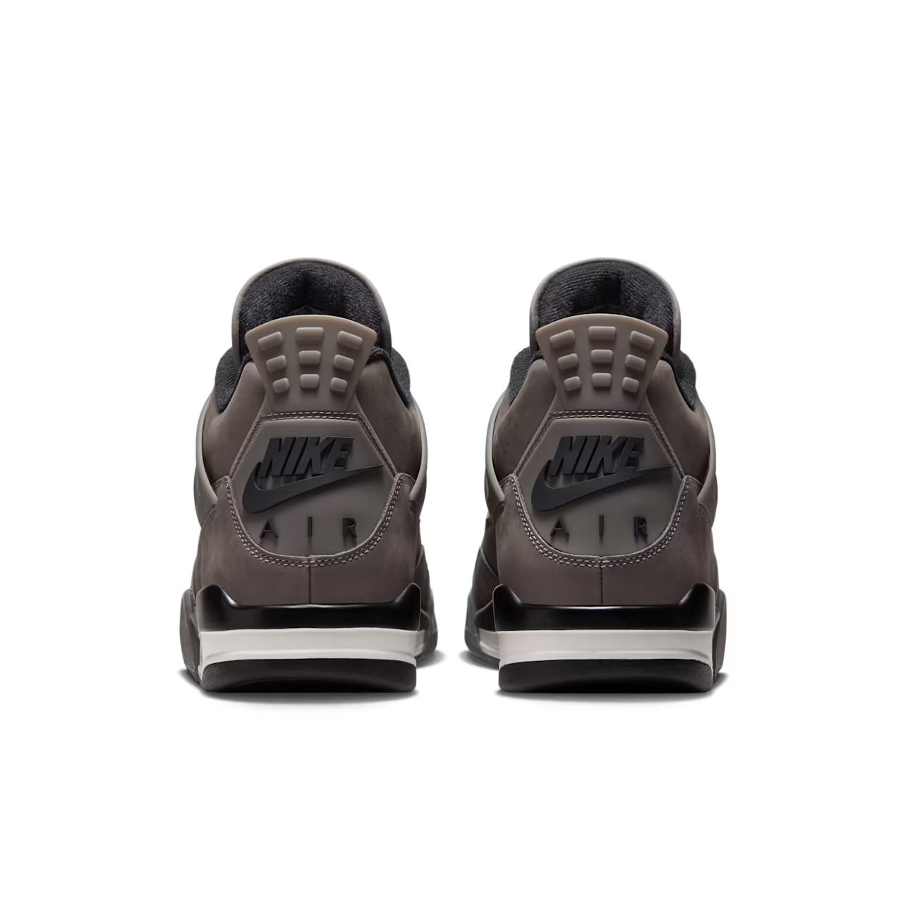 Two dark brown Nike Air Jordan sneakers from the back, black Nike logo on heels.
