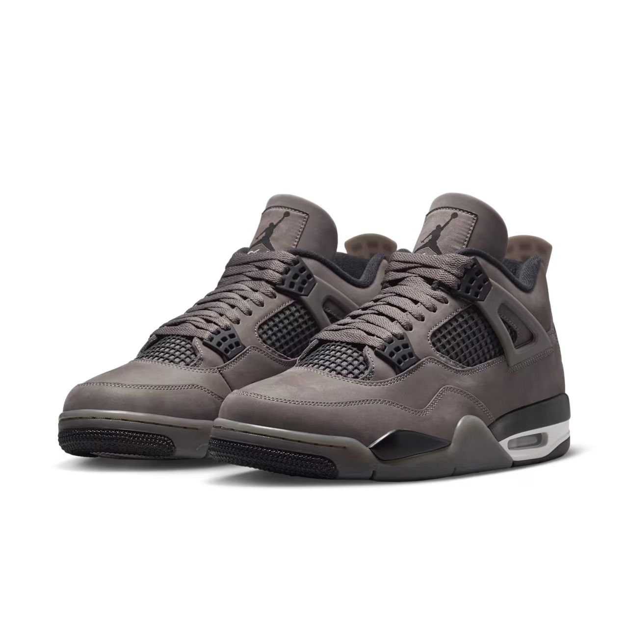 Pair of grey and black Air Jordan 4 sneakers.