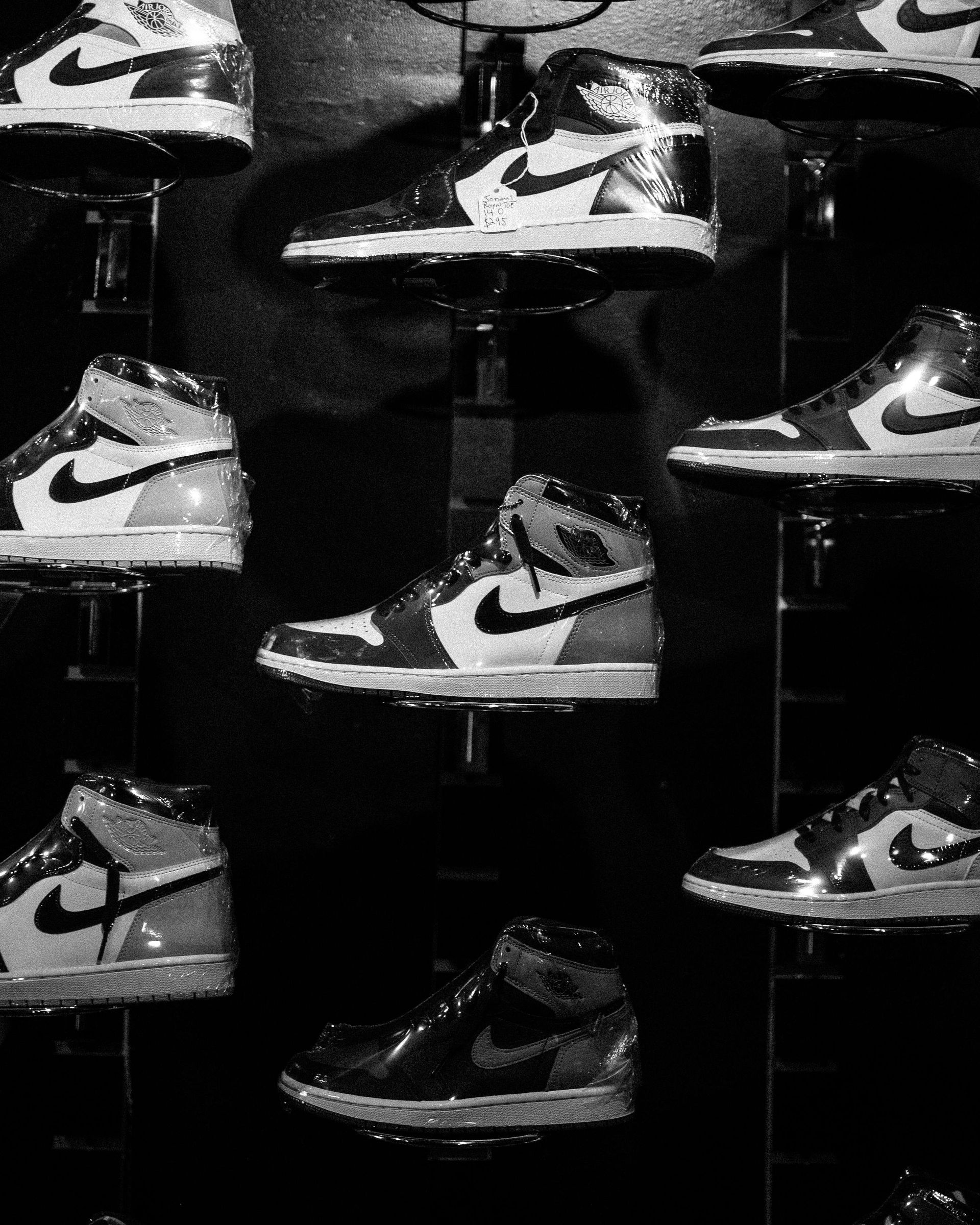 Rows of Air Jordan sneakers displayed on a rack in a store.