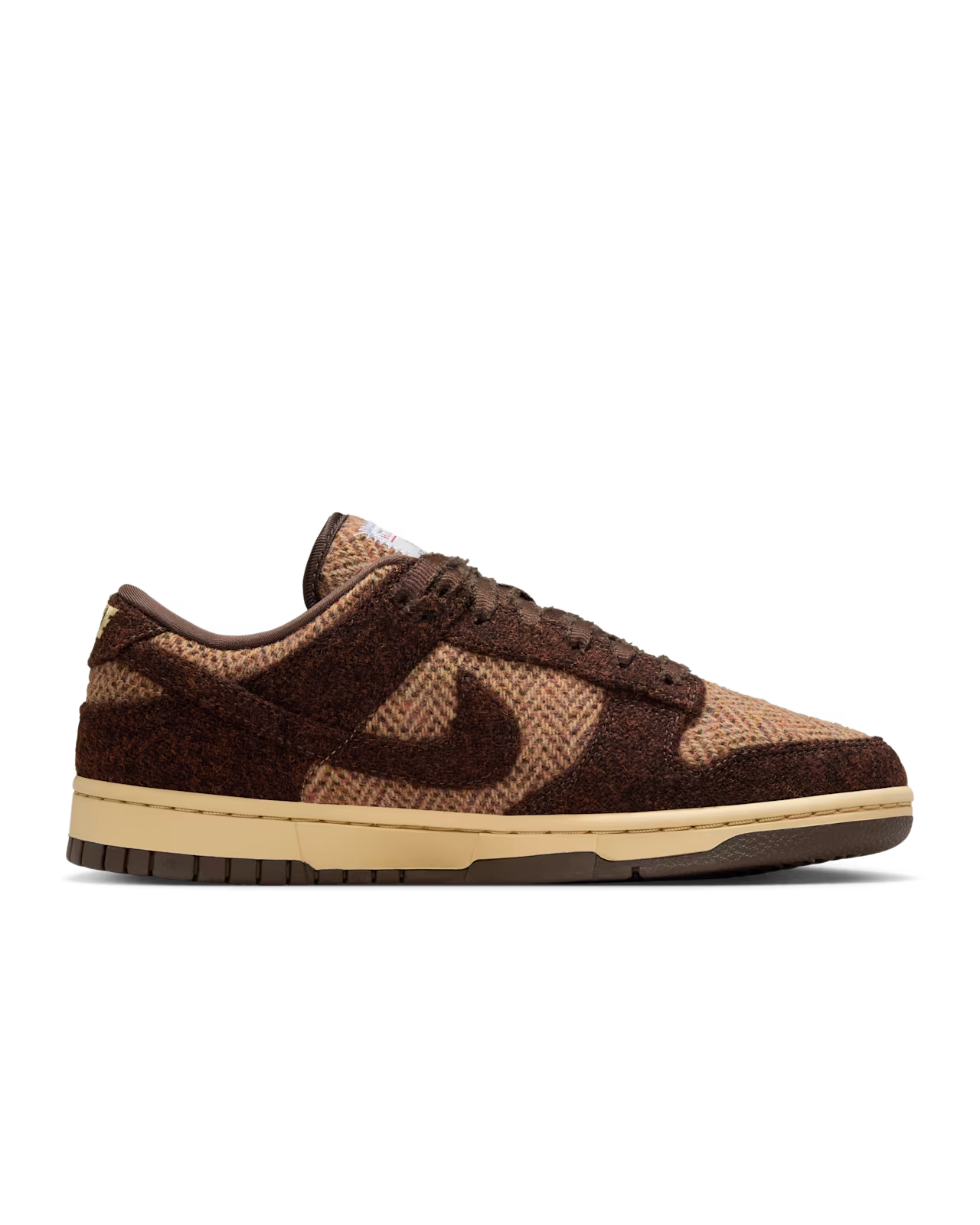 Brown and tan Nike Dunk Low sneakers with textured upper and a light sole.