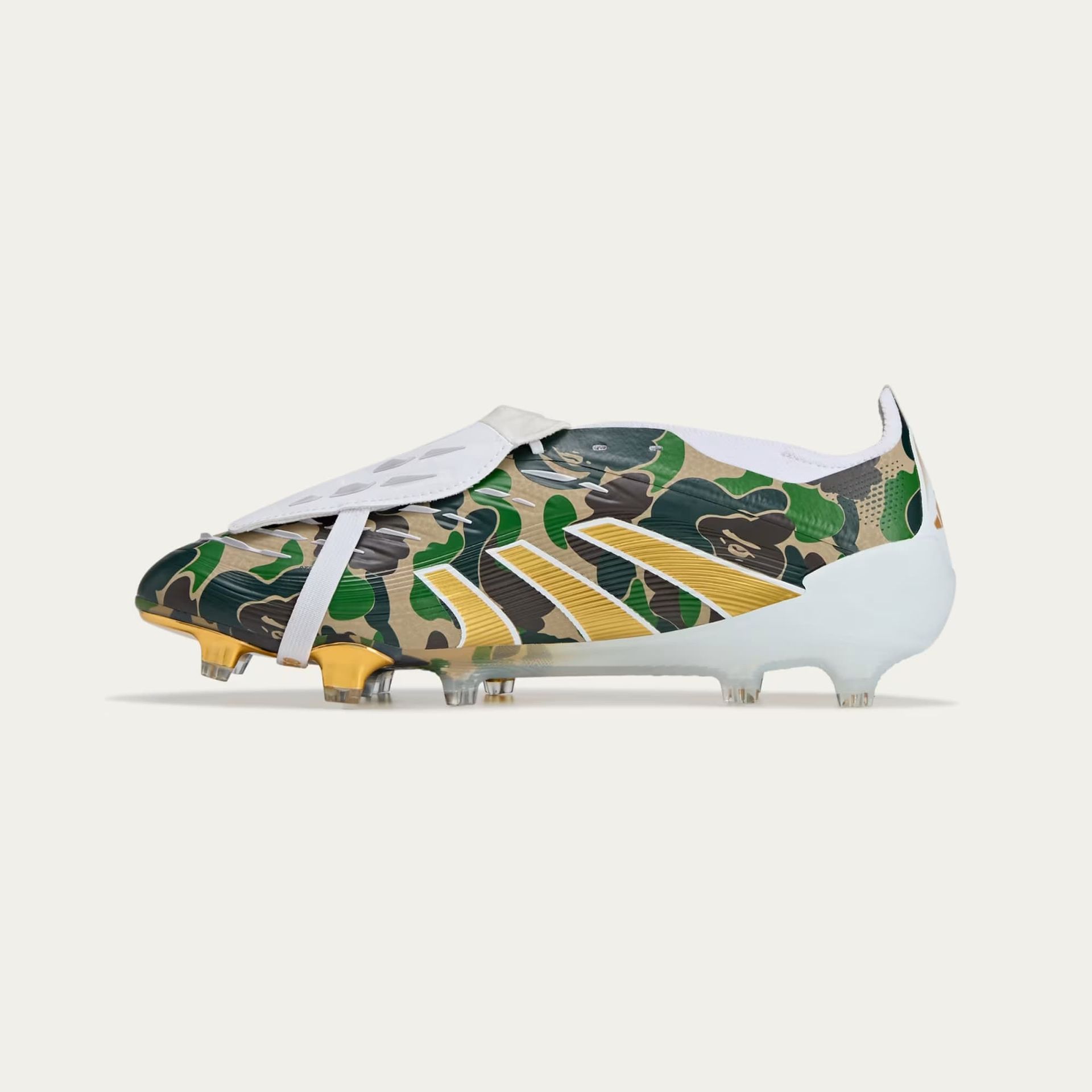 Camouflage-patterned Adidas soccer cleat with white and gold accents.