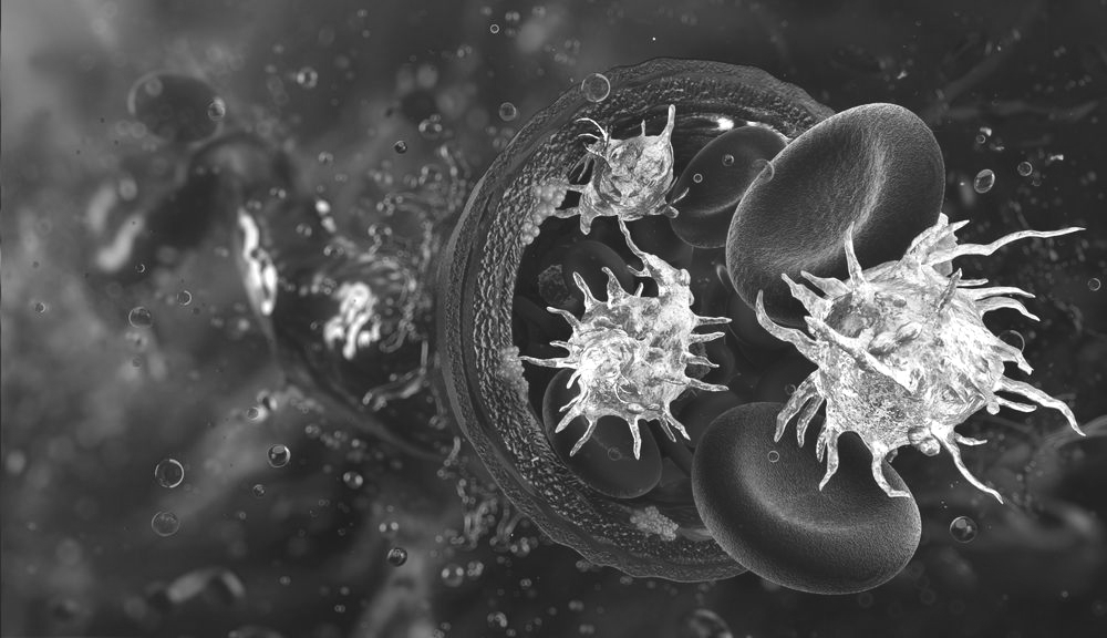 A person in athletic wear holding their wrist in a black-and-white outdoor sports setting.