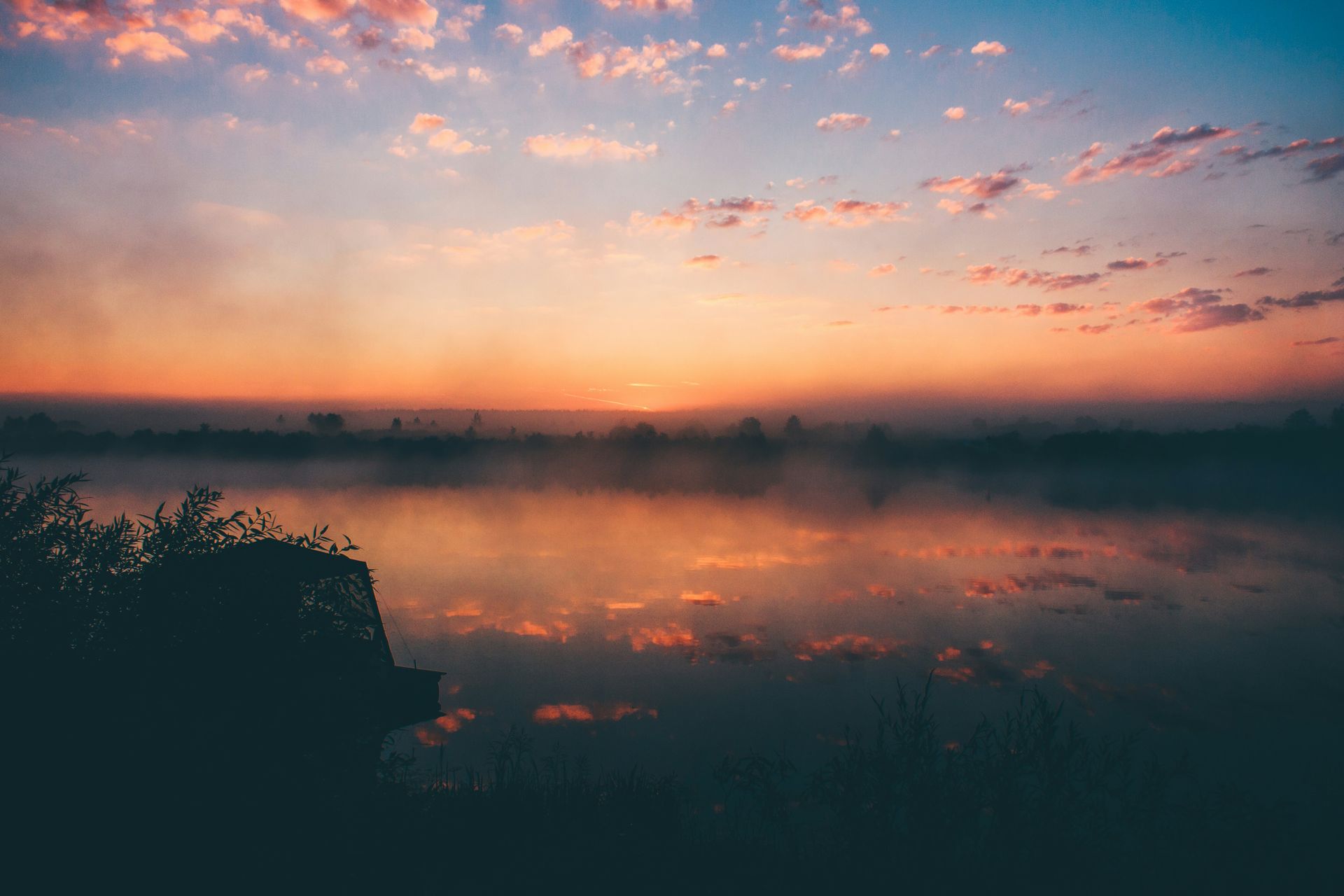 Sunrise over a calm river, symbolising early-stage growth, new beginnings and long-term business