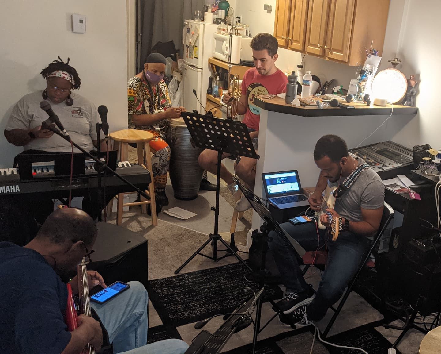A group of men are playing instruments in a living room.