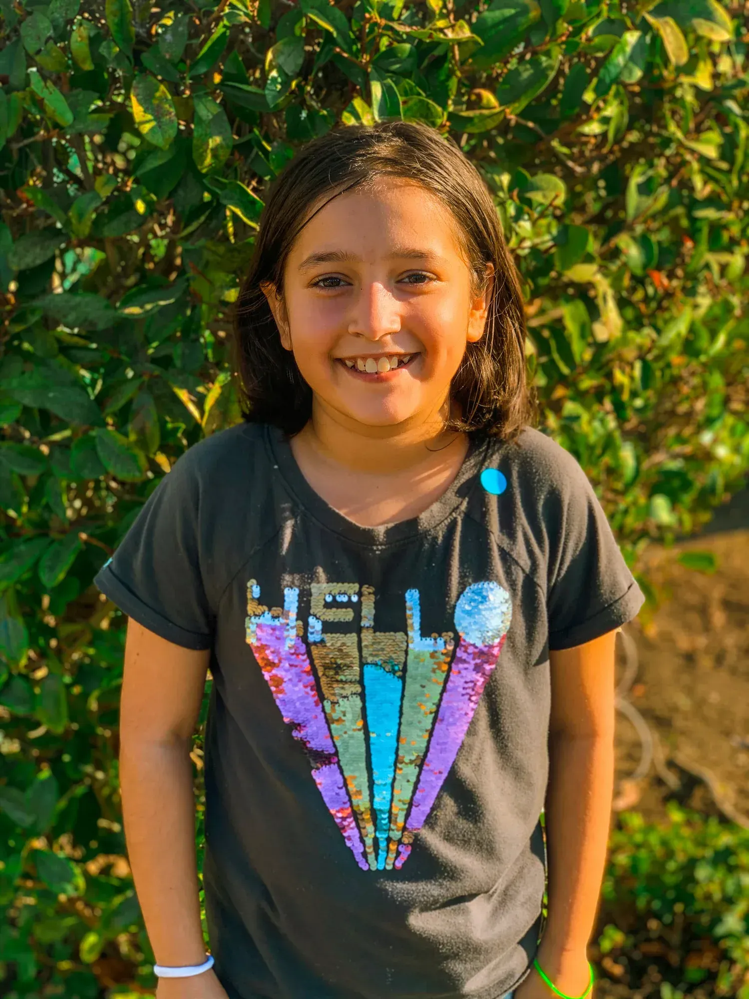 Smiling child in a dark t-shirt with