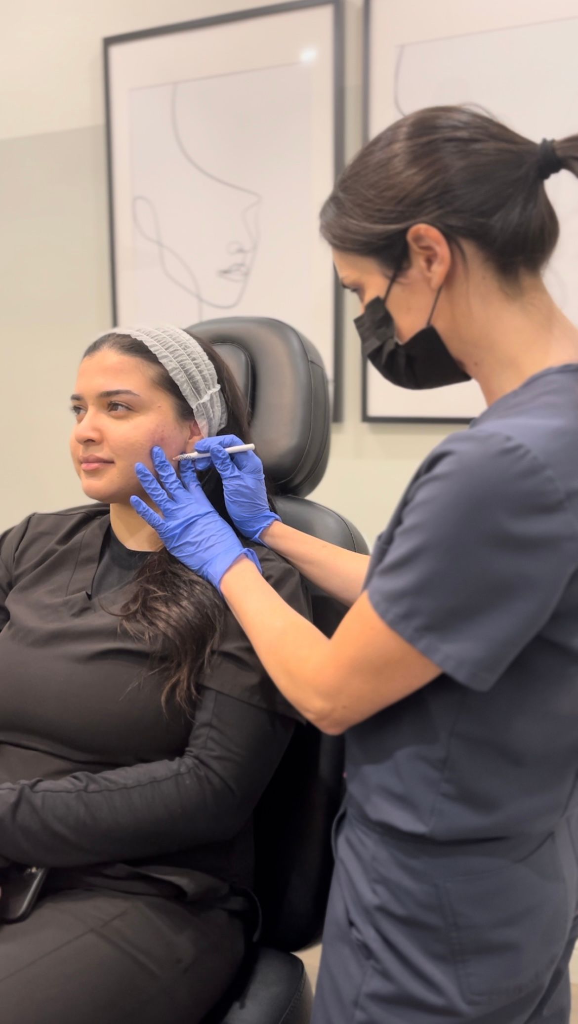 A woman is getting a botox injection in her face.