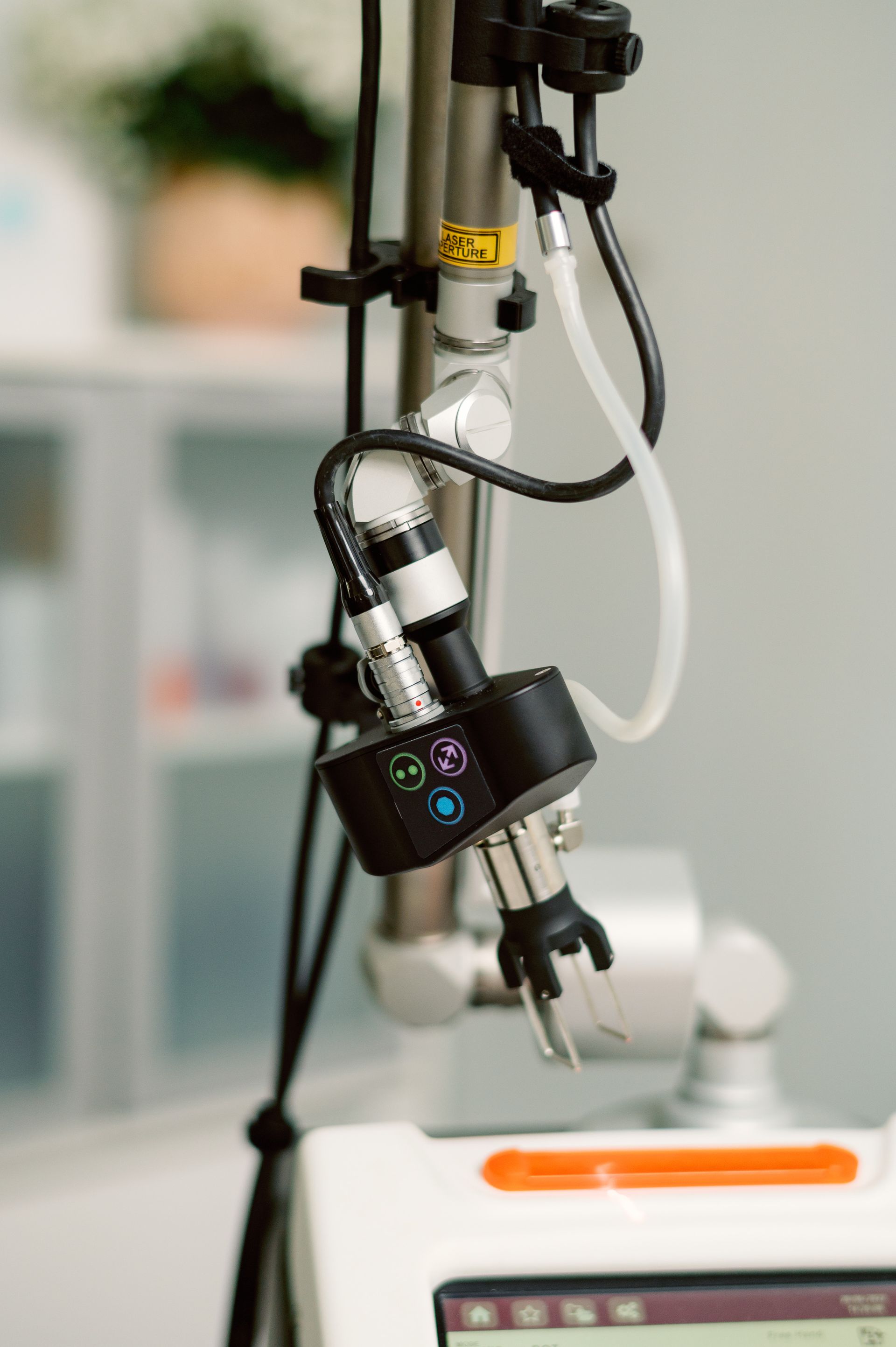 A close up of a machine with a hose attached to it.