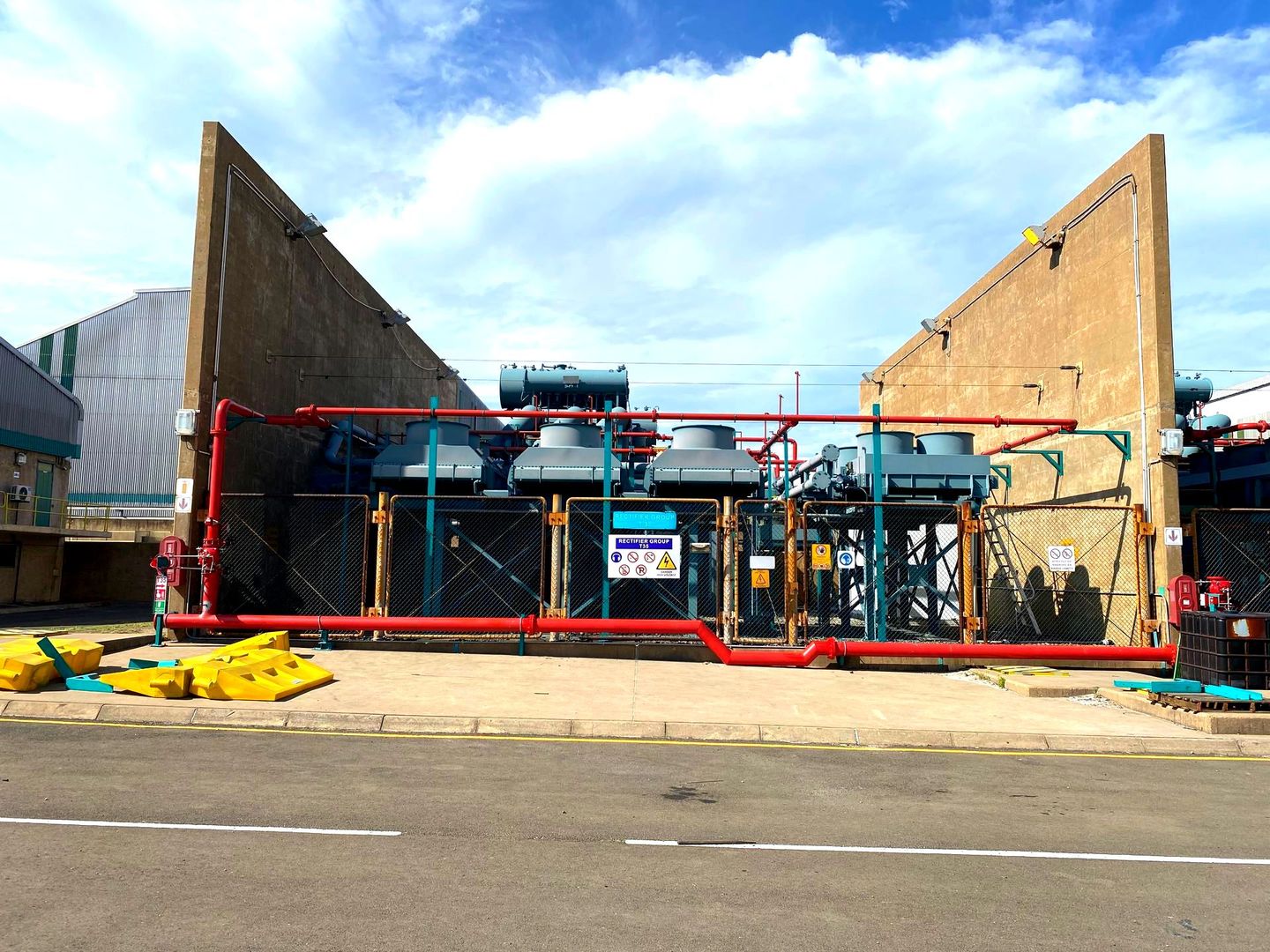 A large building with a lot of pipes coming out of it
