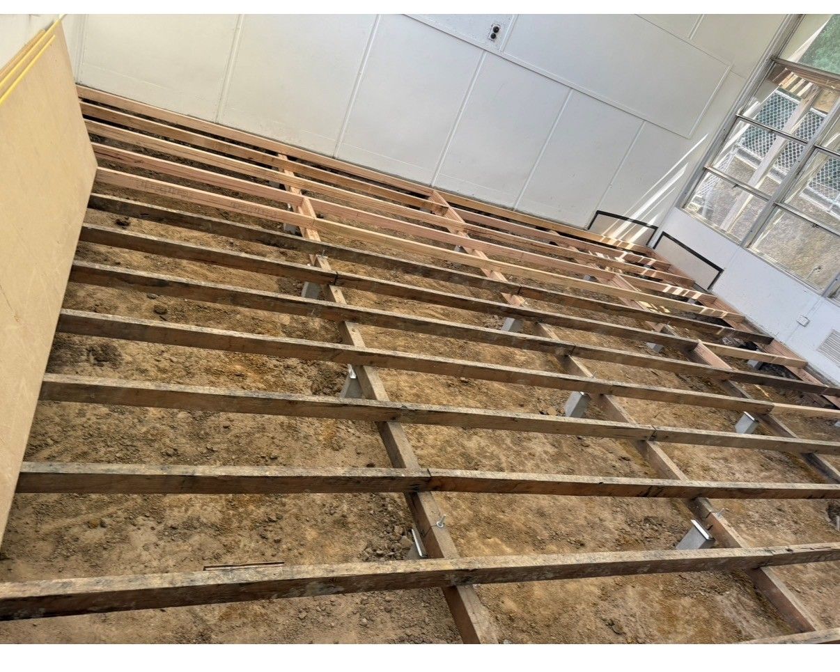 Wooden wall under construction with insulation in place.