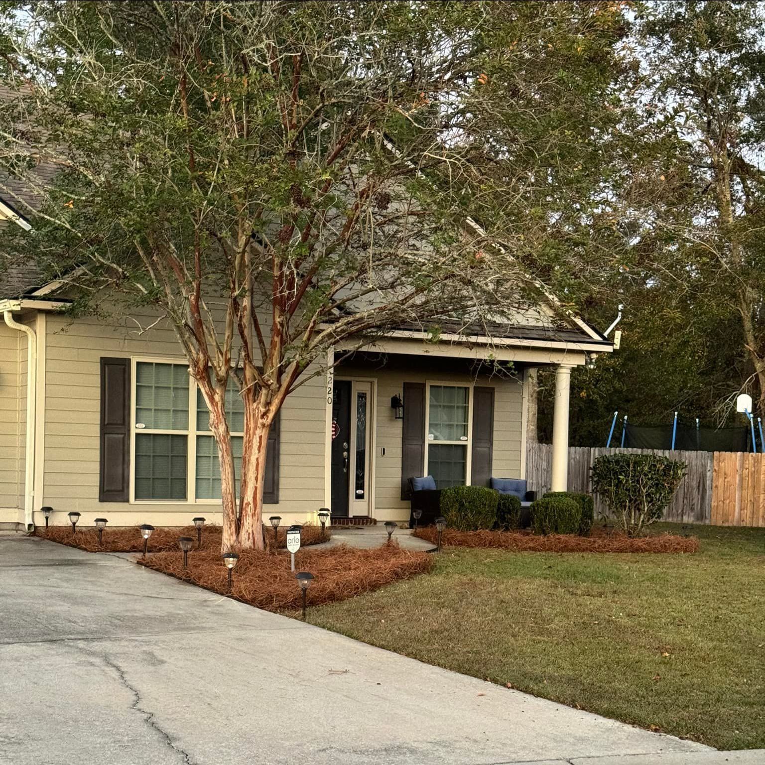 A house with a tree in front of it