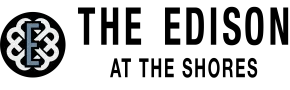 Logo of "The Edison at the Shores," with a stylized "E" inside a circle.