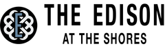 Logo of "The Edison at the Shores," with a stylized "E" inside a circle.