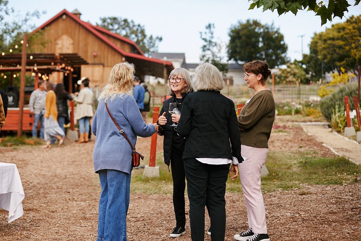 two women are holding hands together