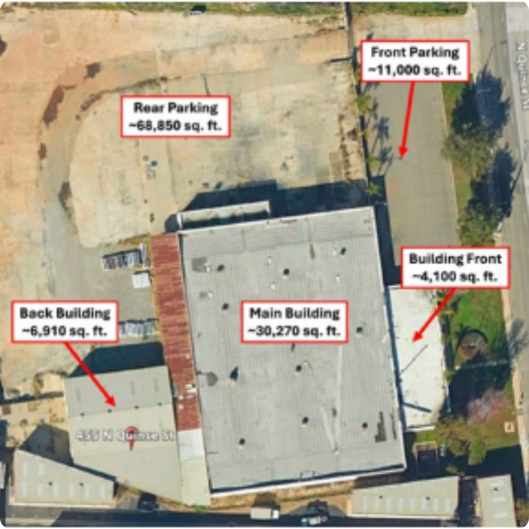 Aerial view of innovation hub property with parking and buildings
