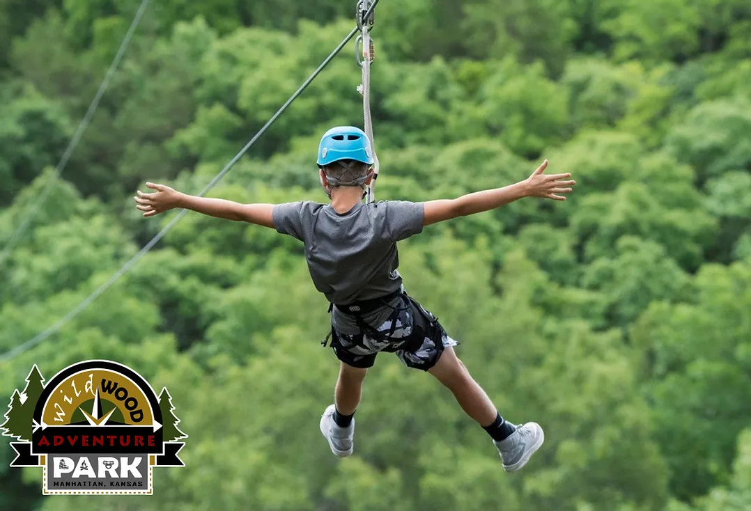 kid zip lining at wildwood adventure park