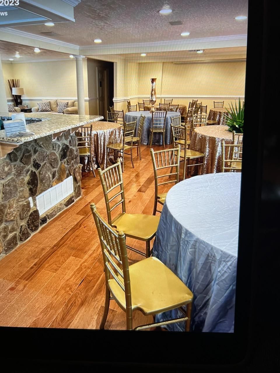 A large room with tables and chairs in it