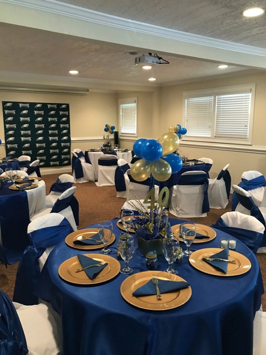 A room with blue and gold tables and chairs