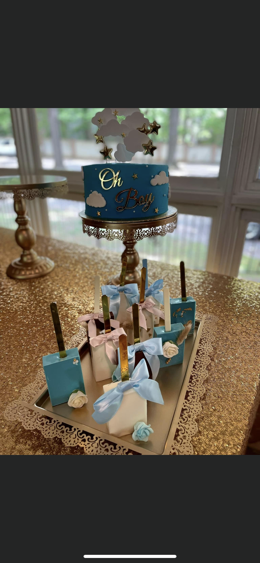 A cake sitting on top of a cake stand on a table.