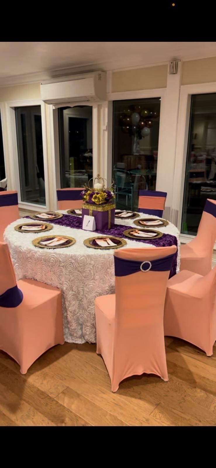 A table and chairs are set up for a wedding reception.