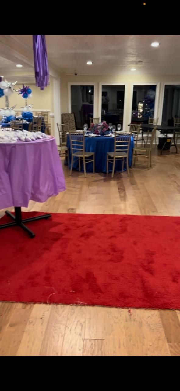 There is a red carpet in the middle of the room.