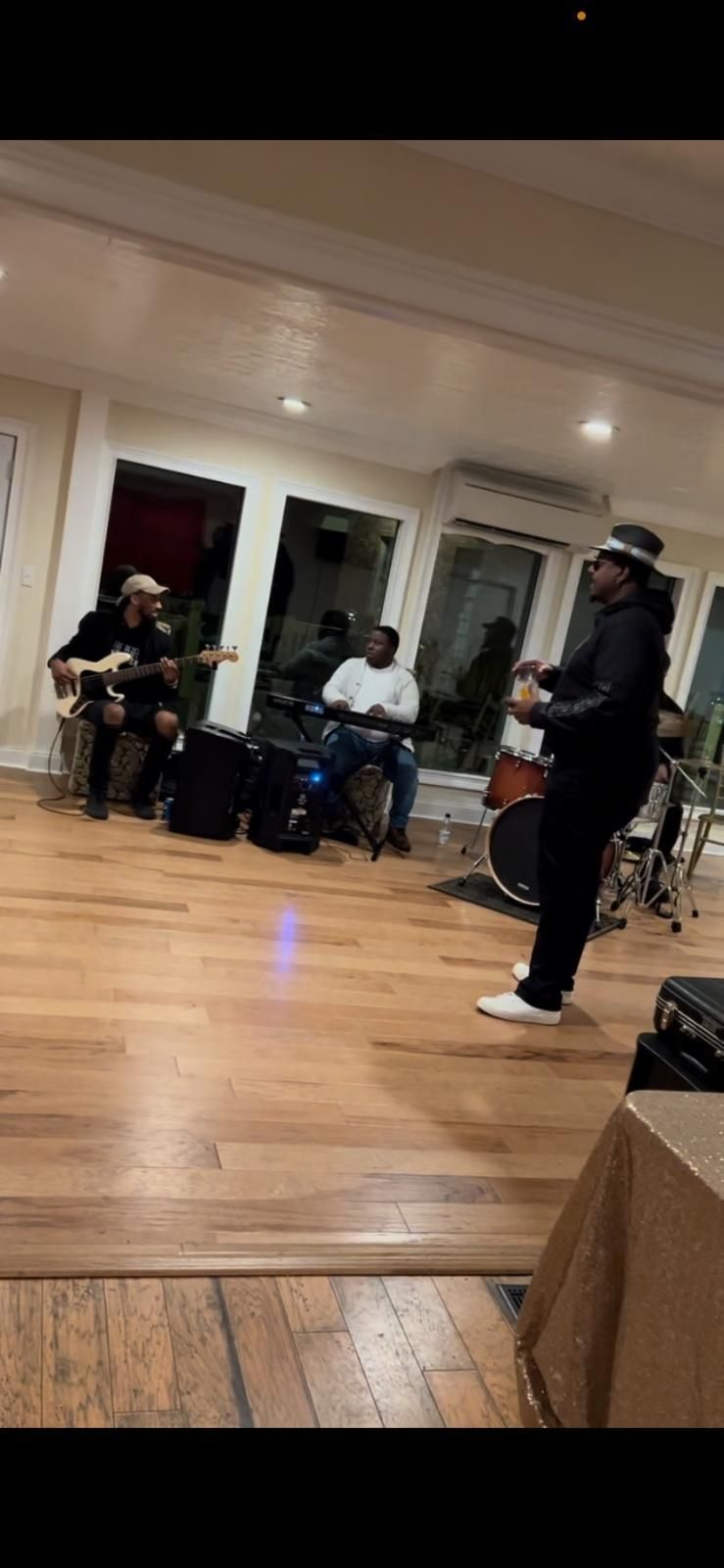 A group of people are playing instruments in a room.