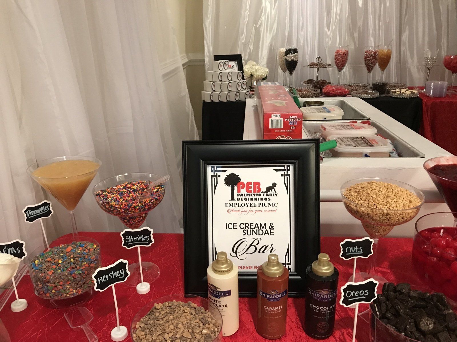 A table with a sign that says ice cream bar on it.