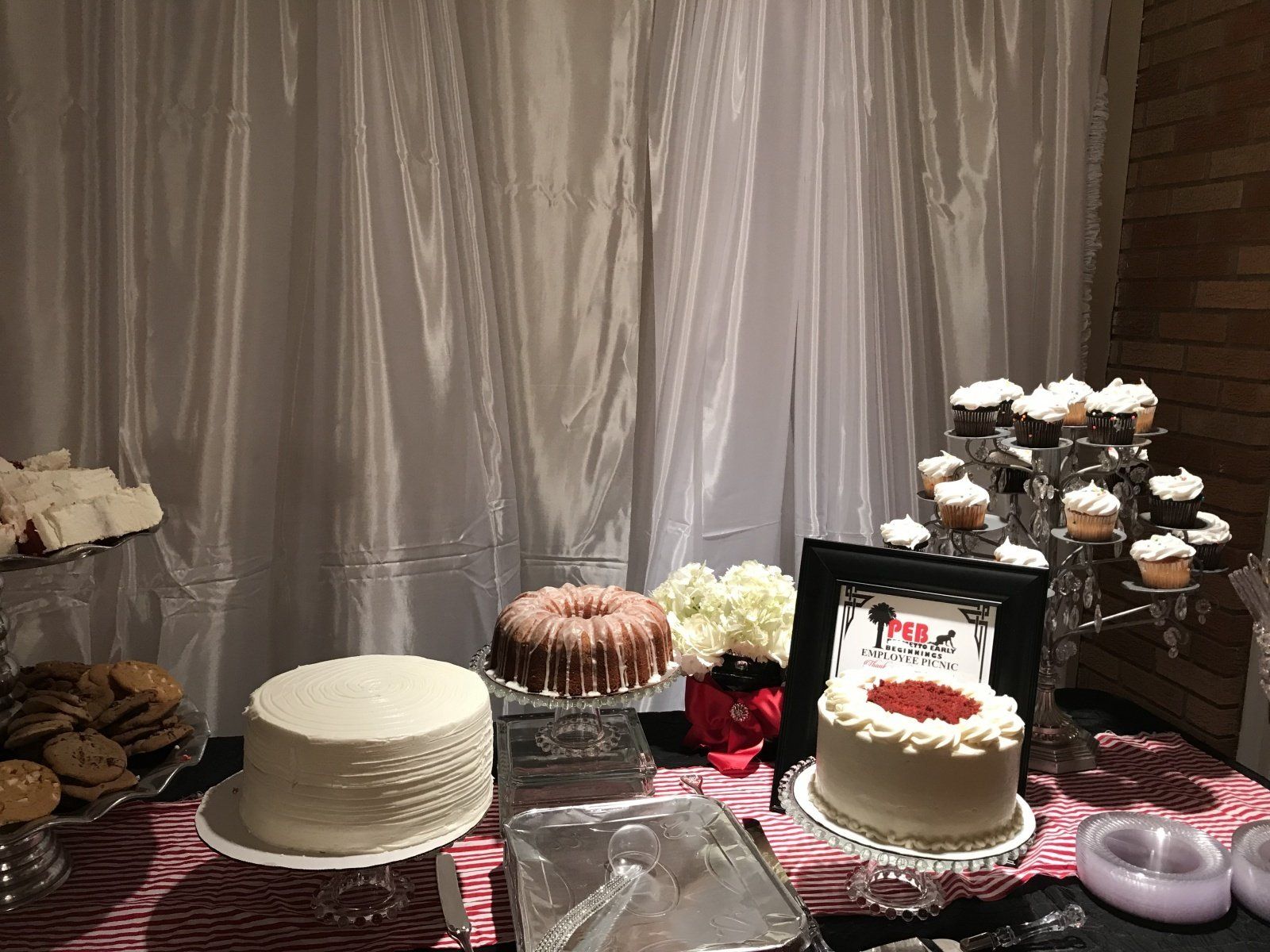 A table topped with a variety of cakes and cupcakes.