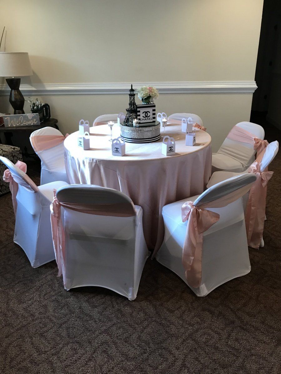 A table and chairs are set up for a wedding reception.